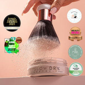 glowdry self tan drying powder with multi awards shown around the drying powder and  powder brush
