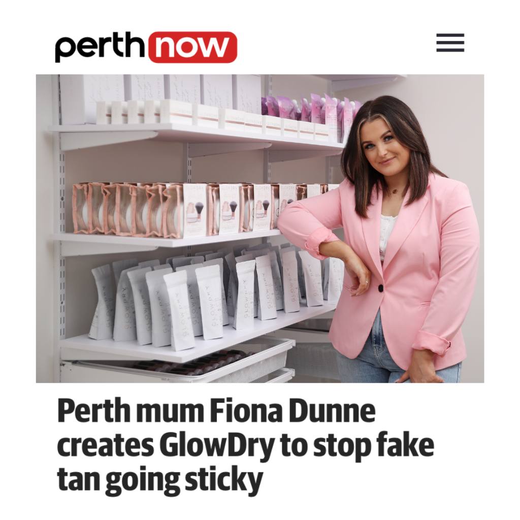 fiona dunne owner and founder of glowdry australia fake tan drying powder poses in front of shelves of slef tanning product and setting powder