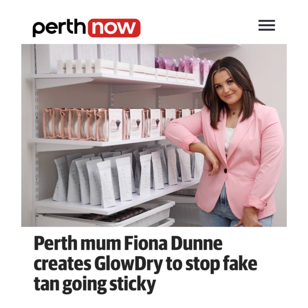 fiona dunne owner and founder of glowdry australia fake tan drying powder poses in front of shelves of slef tanning product and setting powder