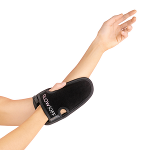 exfoliating mitt on hand and arm
