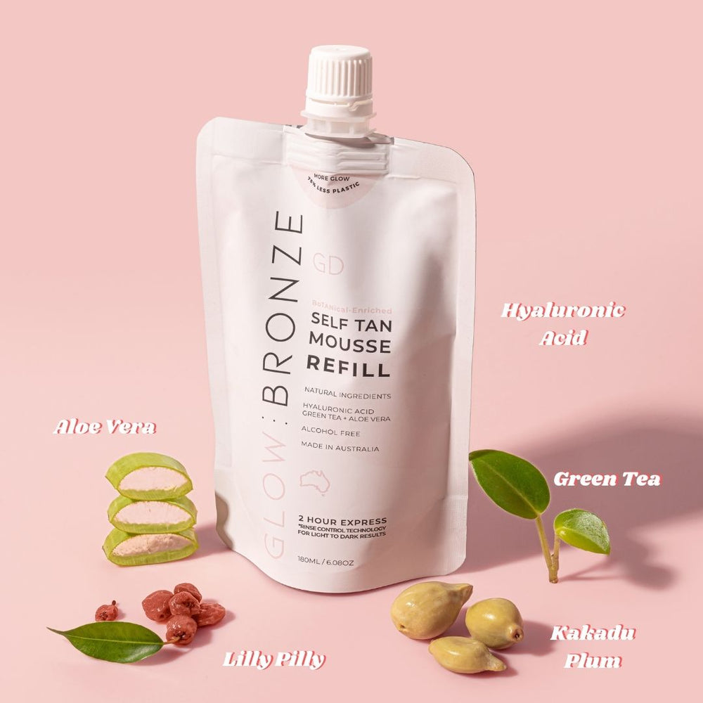 glowdry-glowbronze-self-tanning-mousse-refill-on-pink-background-with-water-showing-hydration-sustainable