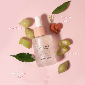 glowdry new face and body glow drops laying flat on pink surface with Australian botanical ingredients